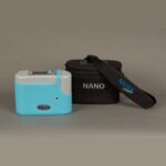 NIDEK Nano portable oxygen concentrator with its carrying bag